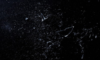 Explosion glass, dust and piece texture and background, isolated on black, cracked window effect 