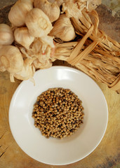 Garlic, pepper and dry chili main ingredient of cooking Thai food preparation by blending and mixing in stone mortar and mix in meat, pork or chicken for cooking Thai curry, have space for write wordi