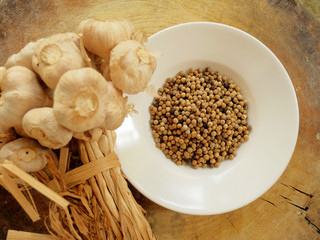 Garlic, pepper and dry chili main ingredient of cooking Thai food preparation by blending and mixing in stone mortar and mix in meat, pork or chicken for cooking Thai curry, have space for write wordi