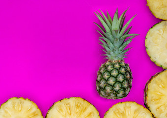 Pineapples on pink background.