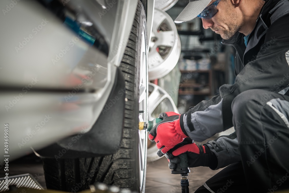 Wall mural Auto Mechanic Wheel Change