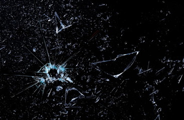 Bullet effect, broken glass texture and background, isolated on black, cracked window, series