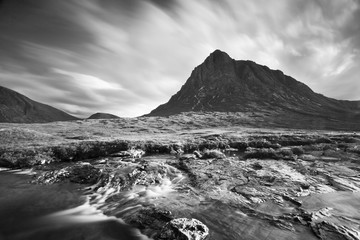 View towards Rannoch Moor, River Coupall in foreground, Beinn a' Chrulaiste on left. Highland, Scotland, UK. The mountain is Buachaille Etive Mor. It is located in Glencoe in the Lochaber region