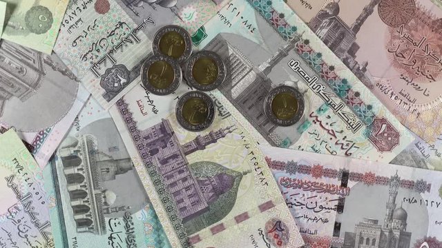 Egyptian pound bills and coins rotating. Egypt money currency. 4K stock video footage