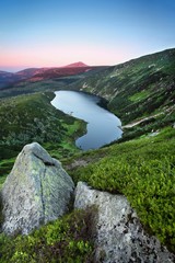 View of famous mountain lake Wielki Staw in Giant mountains (Krkonose National Park), Poland and...