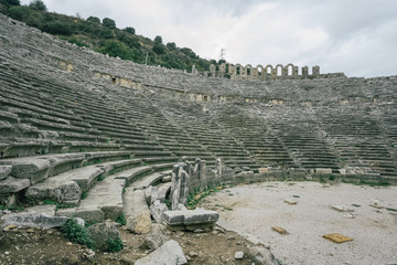 Historical site of Perge or Perga in Antalya, Turkey. Ancient stage of theatre. Vast remains of...
