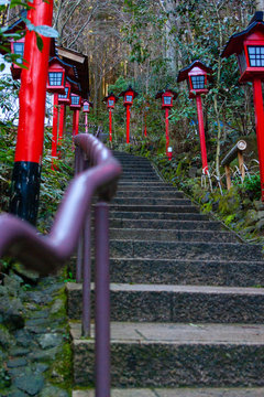Purple handrails and red lanterns in Japanese temple 