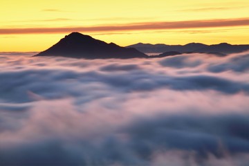 Panoramic view of idyllic mountain scenery in the Alps with fresh green meadows on a beautiful sunny day in springtime, panoramic view of mountains at border of France and Swiss and Italy