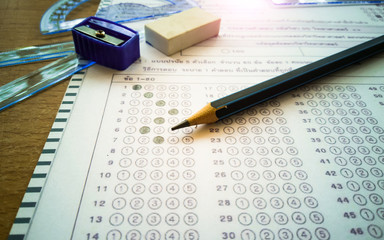 The stationery is placed on the answer sheet with the concept of education.