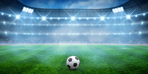 Soccer ball on green stadium