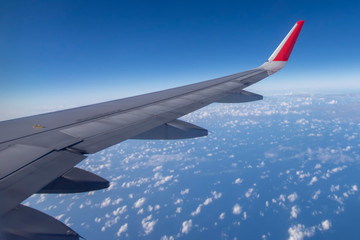 Obraz premium Aeroplane wing view from window beautiful sky. Traveling concept