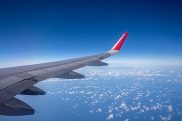 Aeroplane wing view from window beautiful sky. Traveling concept