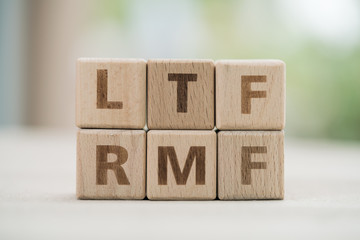 Wood block word LTF and RMF with copy space using as background business financial, saving money, retirement concept...