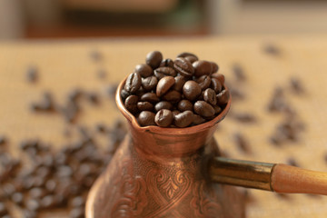 Turk with coffee beans. Traditional coffee. Close-up.