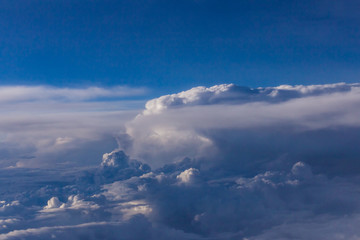 White clouds and blue sky from an airplane