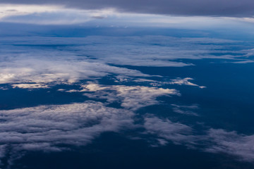 White clouds and blue sky from an airplane