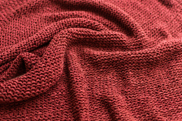 Fototapeta na wymiar Red knitted sweater, background
