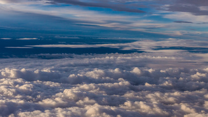 White clouds and blue sky from an airplane