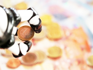 Obraz na płótnie Canvas Robotic hand with One Euro Coin, close-up