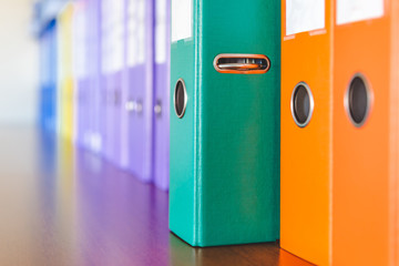 A row of binders for documents in the office