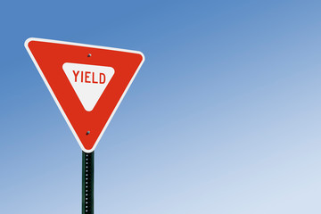 Yield Sign Against Blue Sky