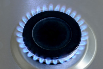 Natural gas burning on kitchen gas stove. View from top