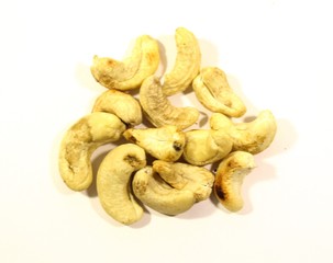 A small amount of nuts on a white background. Delicious and healthy snack for adults and children.