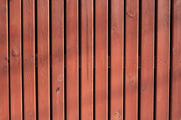 Texture of a red wooden fence