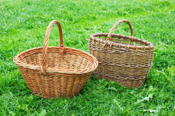 Wicker baskets for mushrooms on green grass