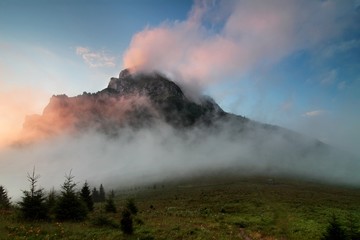 Fototapeta premium Awesome mountains with perfect sky in sunny day. Frosted fog covering the valley in sunlit during sunrise. wonderful picturesque Scene. Amazing Autumn landscape. Beautiful nature background. 