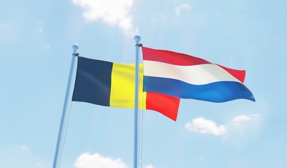 Netherlands and Belgium, two flags waving against blue sky. 3d image