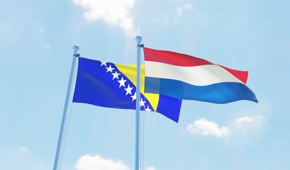Netherlands and Bosnia and Hercegovina, two flags waving against blue sky. 3d image