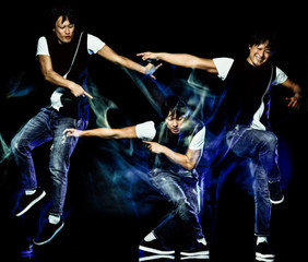 Fototapeta na wymiar one chinese young man hip hop break dancer dancing isolated on black background with speed light painting effect motion blur