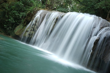 Fototapeta na wymiar long exposure waterfall in forest lagoon - Argens river, France