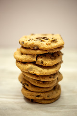 Stack of chocolate chunk cookies on marble counter