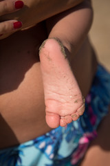 Feet on the sand of a beach