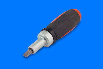 One ratchet screwdriver with orange and black plastic with rubber handle and bit in center on blue background
