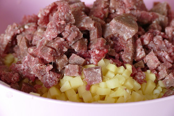 preparing minced potatoes, raw minced meat and chopped potatoes,