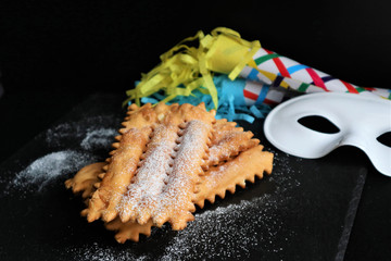 typical italian carnival pasty sprinkled with powdered sugar