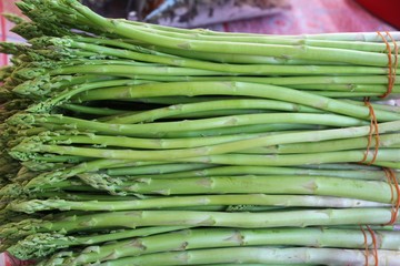 Fresh green asparagus for cooking at market