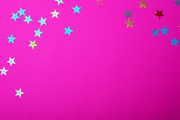 Bright plastic pink color with small shiny stars. Brilliant background for your festive project