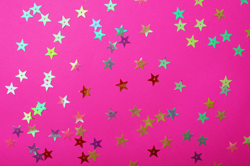 Bright plastic pink color with small shiny stars. Brilliant background for your festive project