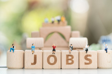 Wood block word JOB and business man with copy space using as background Choice of the best suited employee, HR, HRM, HRD, job recruiter concepts.