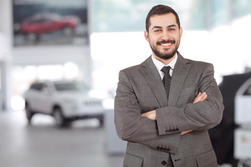 salesman at automotive showroom