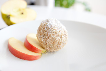 Potato dumplings with apple fullness photographed on white plate