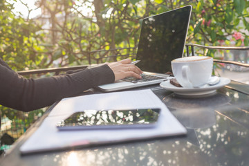 Young woman working under the morning sunshine