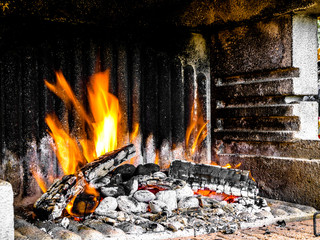 Preparation of a BBQ - wood piled up - fire reaching maximum heat