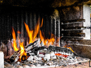Preparation of a BBQ - wood piled up - fire reaching maximum heat