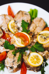 Baked salmon fish fillet with tomatoes,spices., lemon. Diet menu. Healthy food, seafood, Vegetables greens parsley dill