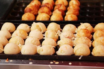 Takoyaki is delicious Japanese food on pan